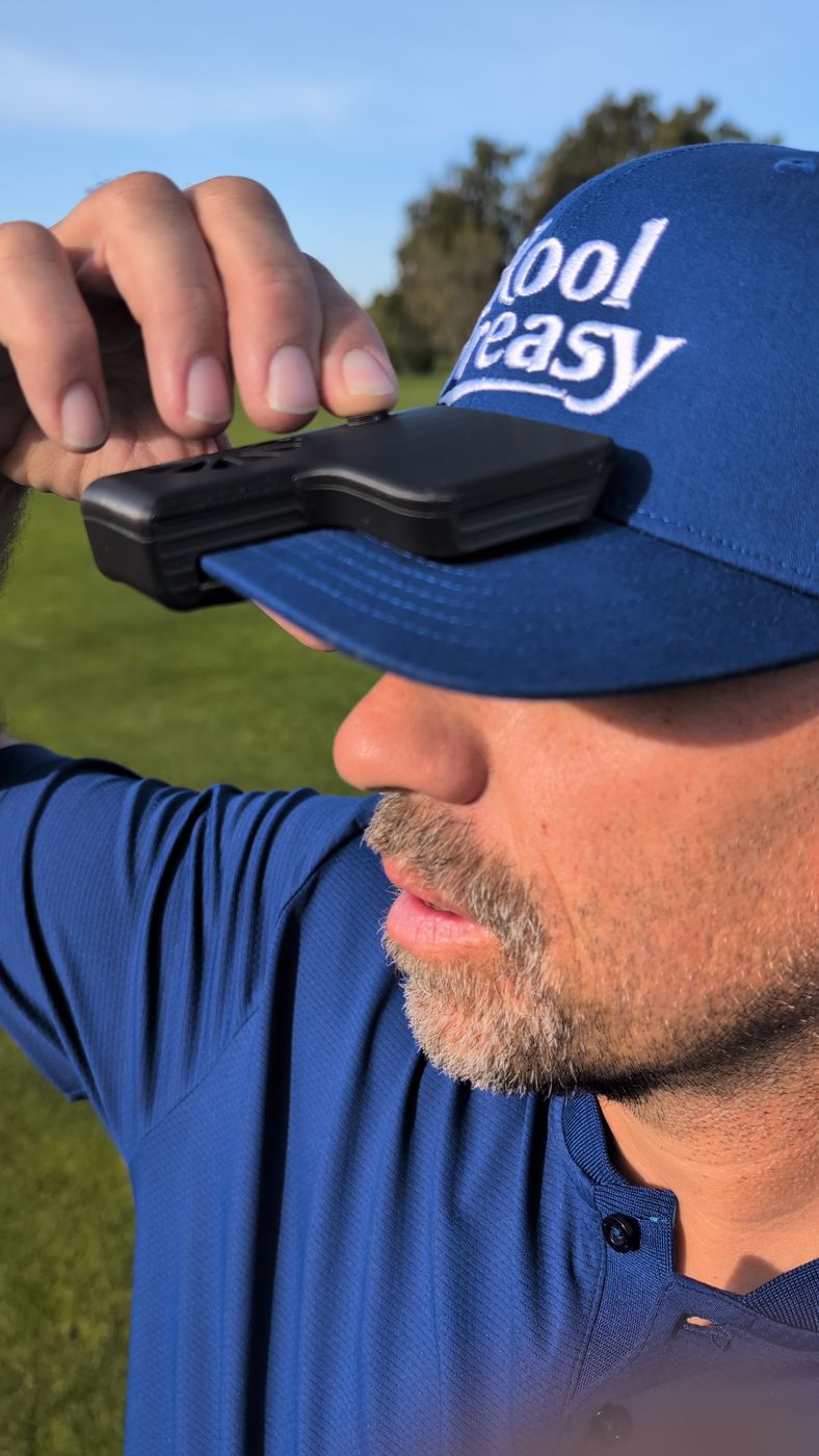 Golfer wearing the Kool Breasy cap fan on the course