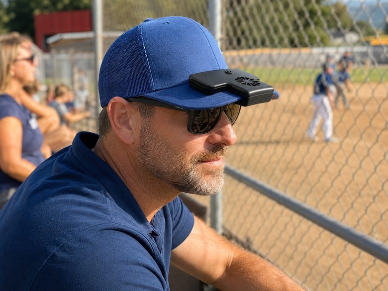 Man wearing Kool Breasy at an outdoor ballgame